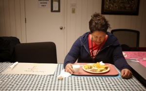 Irene Lopez, 41, takes a moment in prayer at the dinner table at the Holy Spirit Church in San Jose, Calif., on Thursday, Jan. 28, 2016. Three San Jose churches that will shelter, feed and help homeless women rebuild their lives over three months. All of them are "medically fragile" women selected by Catholic Charities. (Josie Lepe/Bay Area News Group)